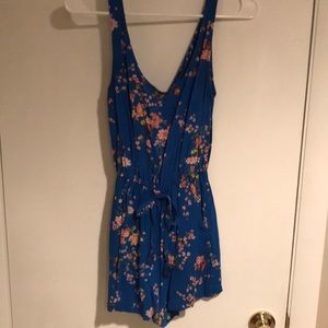 Blue romper with pink flowers from Pimpkie.